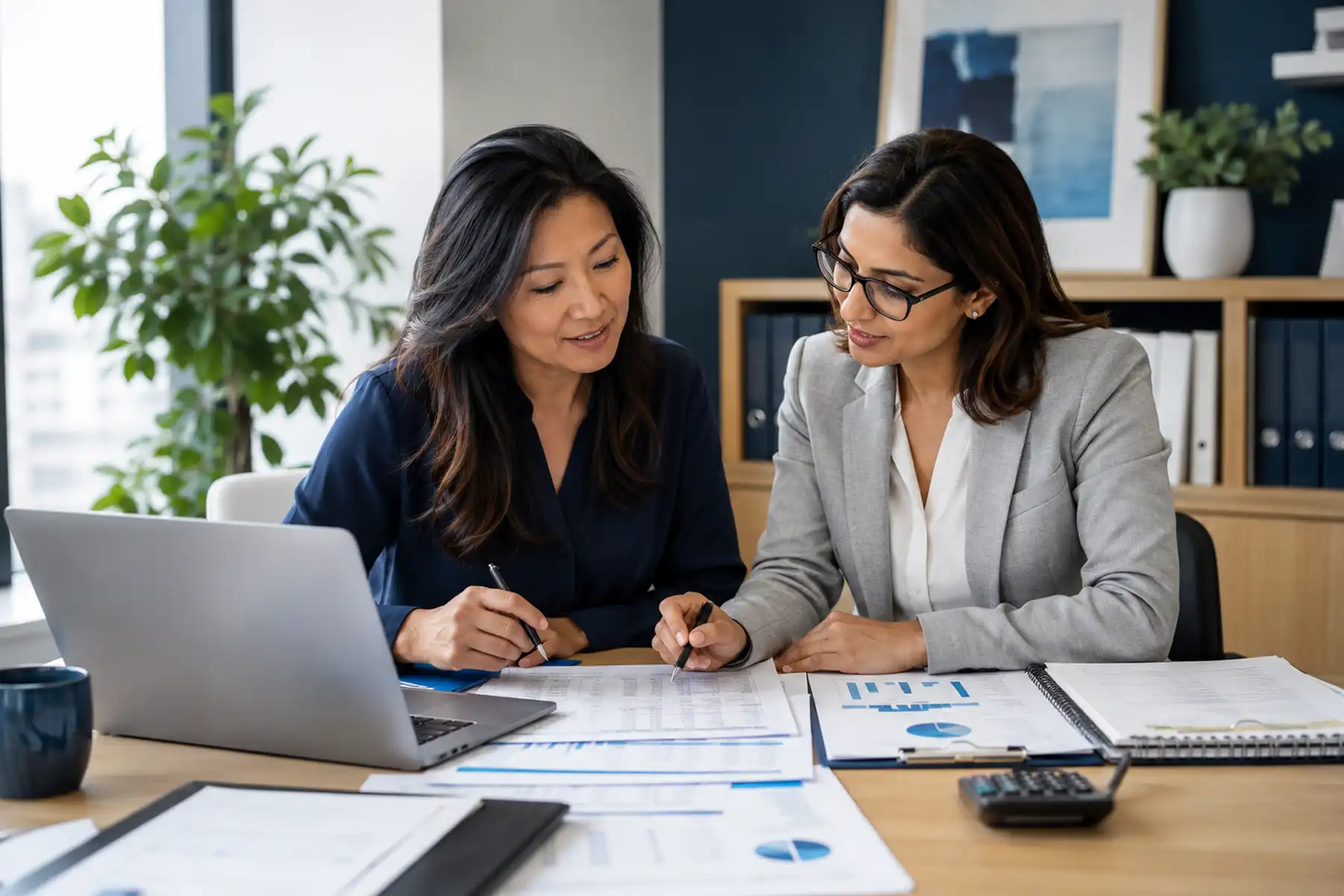 Female company director reviewing company accounts with an accountant before applying for a mortgage.