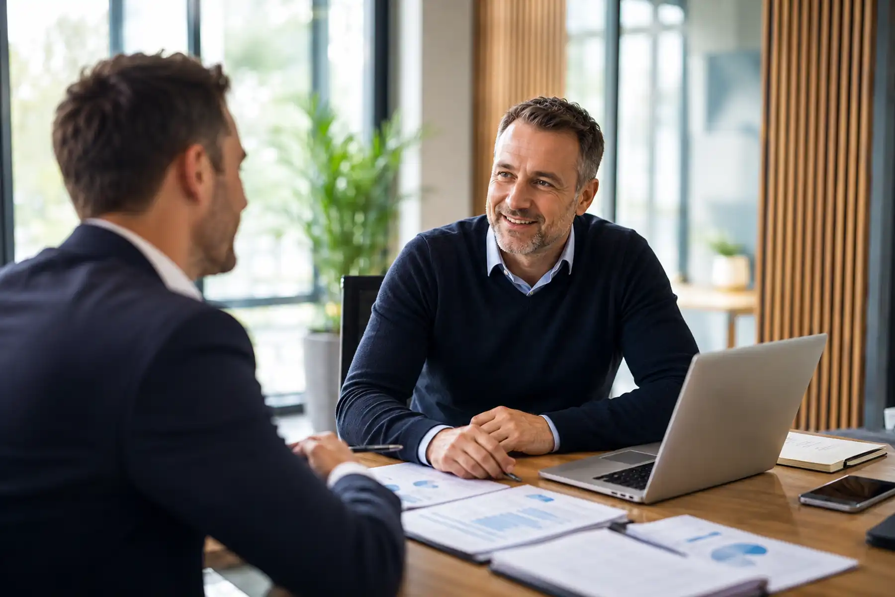 Company director reviewing business finances in a modern office.